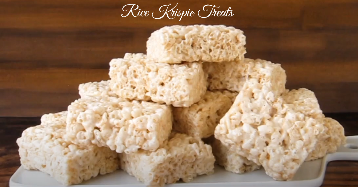 Classic Rice Krispie Treats made with marshmallows, butter, and Rice Krispies cereal, cut into neat squares on a white plate.