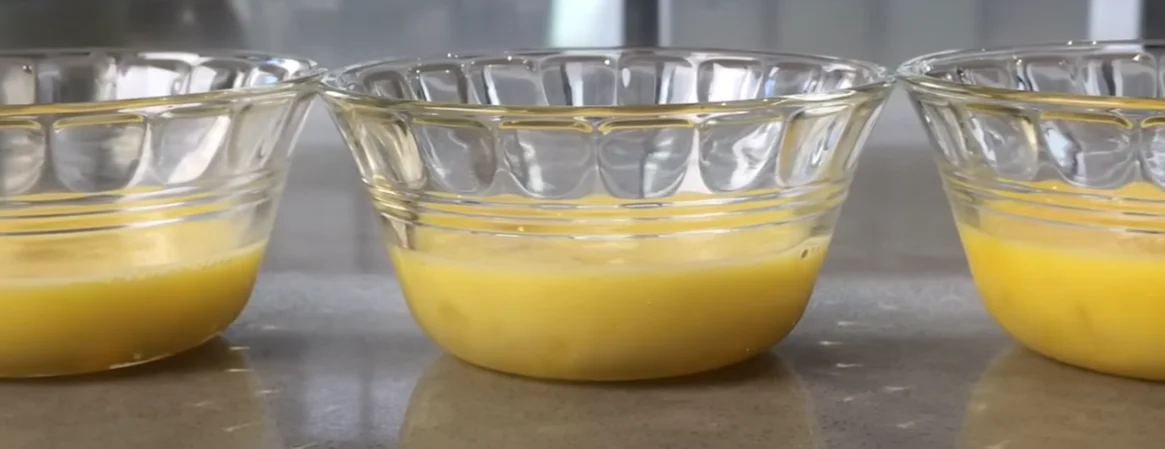 Eggs in a bowl with whisk and flour, showcasing their essential role in cooking and baking recipes.