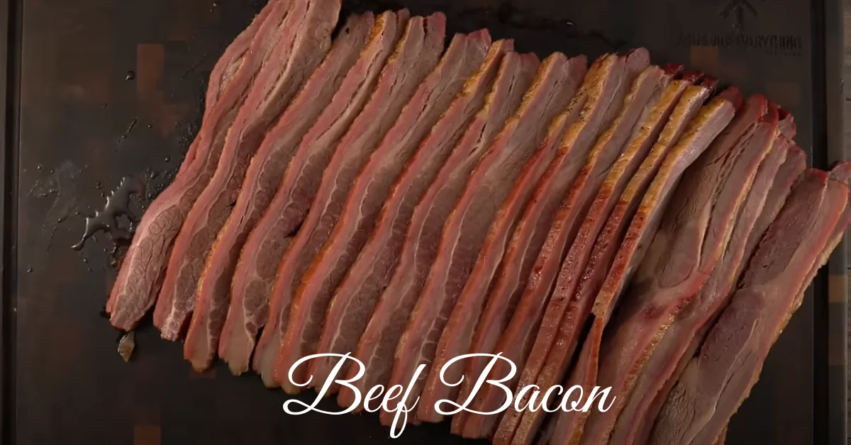 Beef bacon recipes with crispy strips served on a wooden plate alongside fresh herbs and breakfast sides.