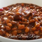 A bowl of baked beans with a rich, smoky, and sweet sauce, garnished with fresh herbs, ready to be served.