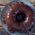 Chocolate cream cheese cake with rich cocoa flavor and a tender texture, styled on a wooden table with cream cheese frosting.