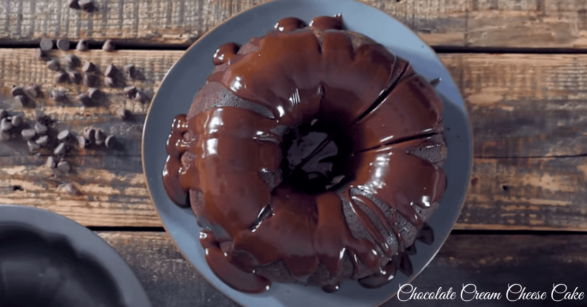 Chocolate cream cheese cake with rich cocoa flavor and a tender texture, styled on a wooden table with cream cheese frosting.