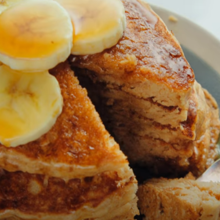 Banana and Whole Wheat Pancakes with Sugar-Free Maple Syrup 3 Golden Banana Whole Wheat Pancakes served with fresh banana slices and syrup."