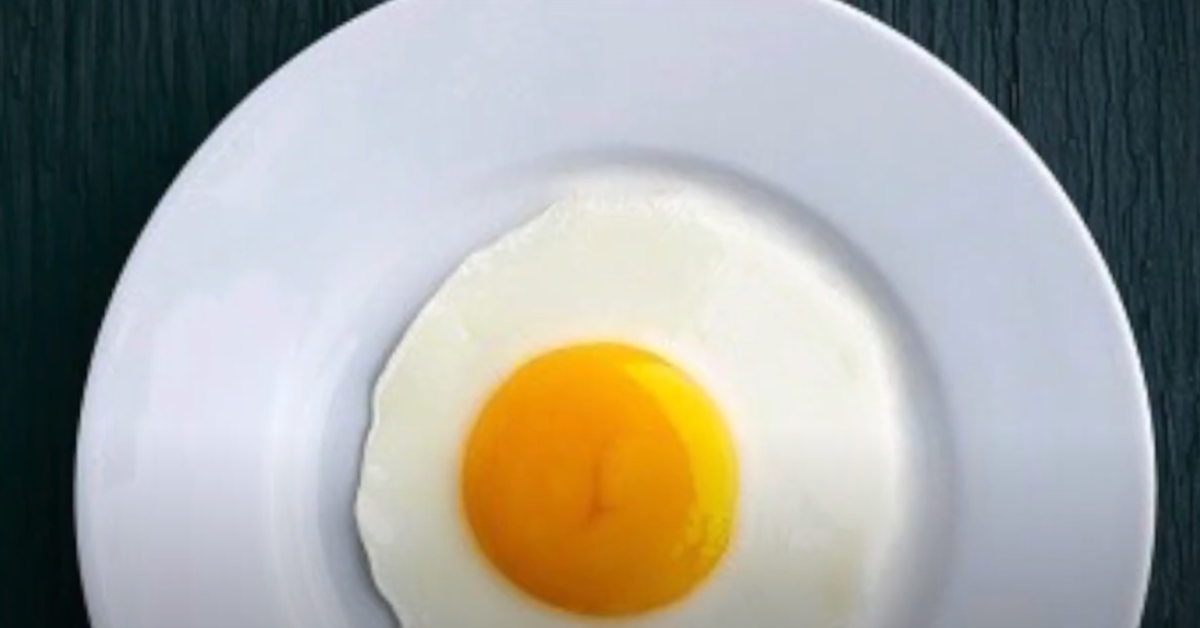 A close-up image of freshly laid eggs in a rustic basket, showcasing a mix of brown and white eggs, with a natural, farm-fresh aesthetic.