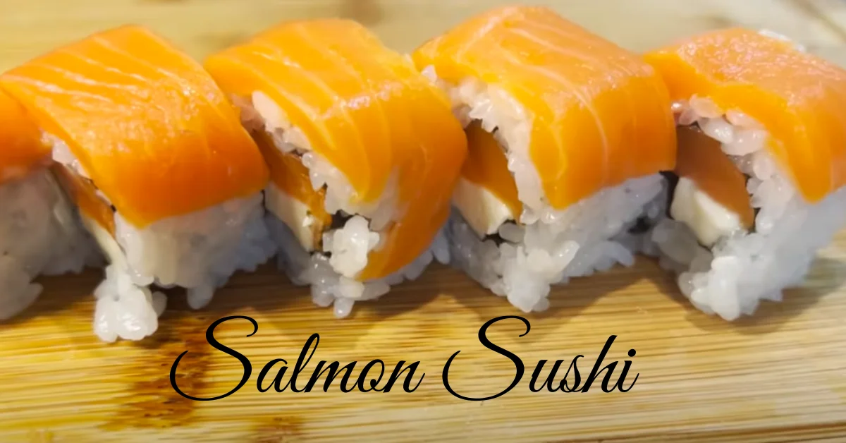 Close-up of fresh salmon sushi on a plate, showcasing vibrant orange-pink salmon on top of vinegared rice.